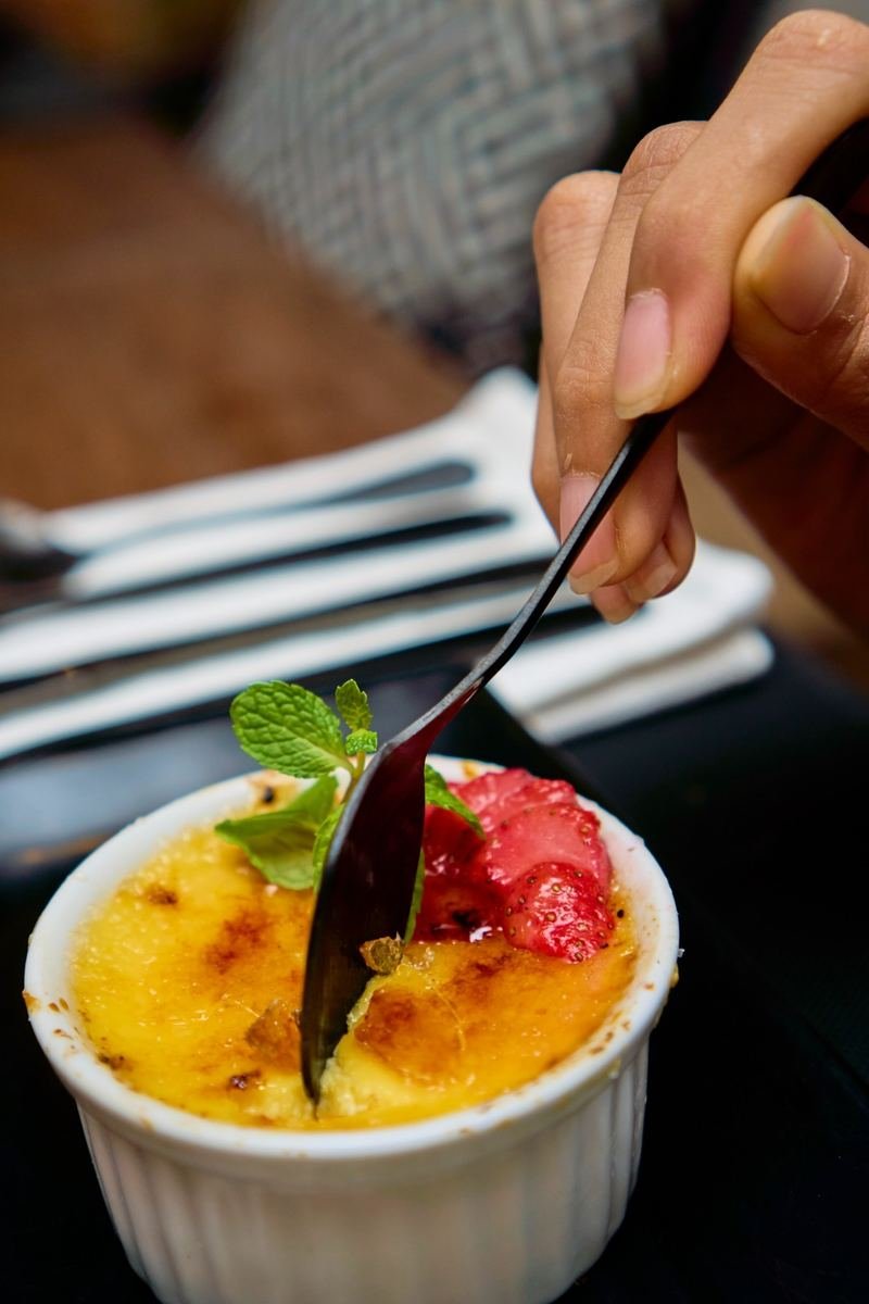 Caramelised custard dessert with strawberry and mint