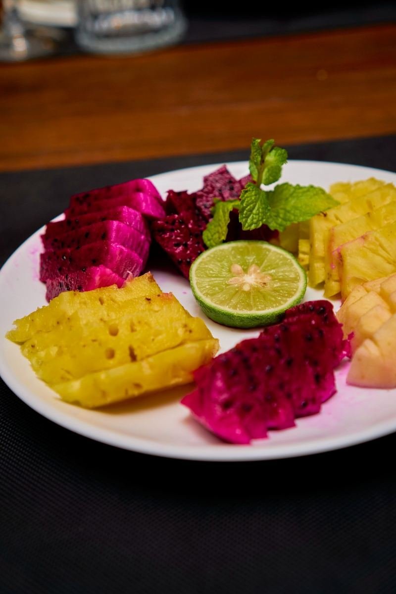 Fresh fruit plate with dragon fruit and pineapple
